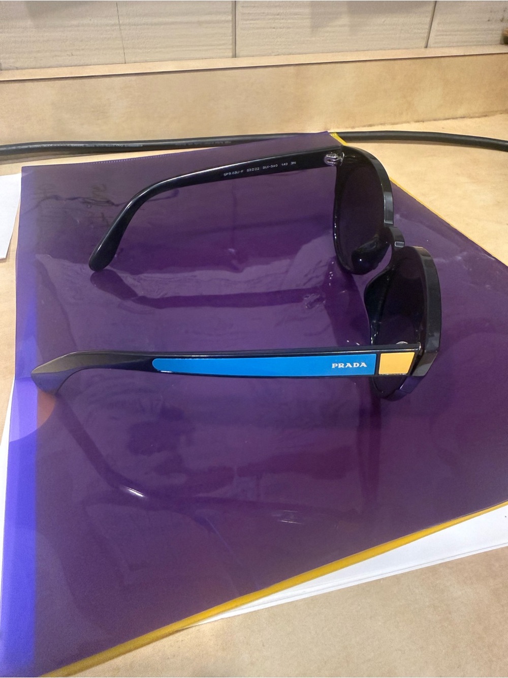 Prada Black Sunglasses with Blue and Yellow Temple Accents